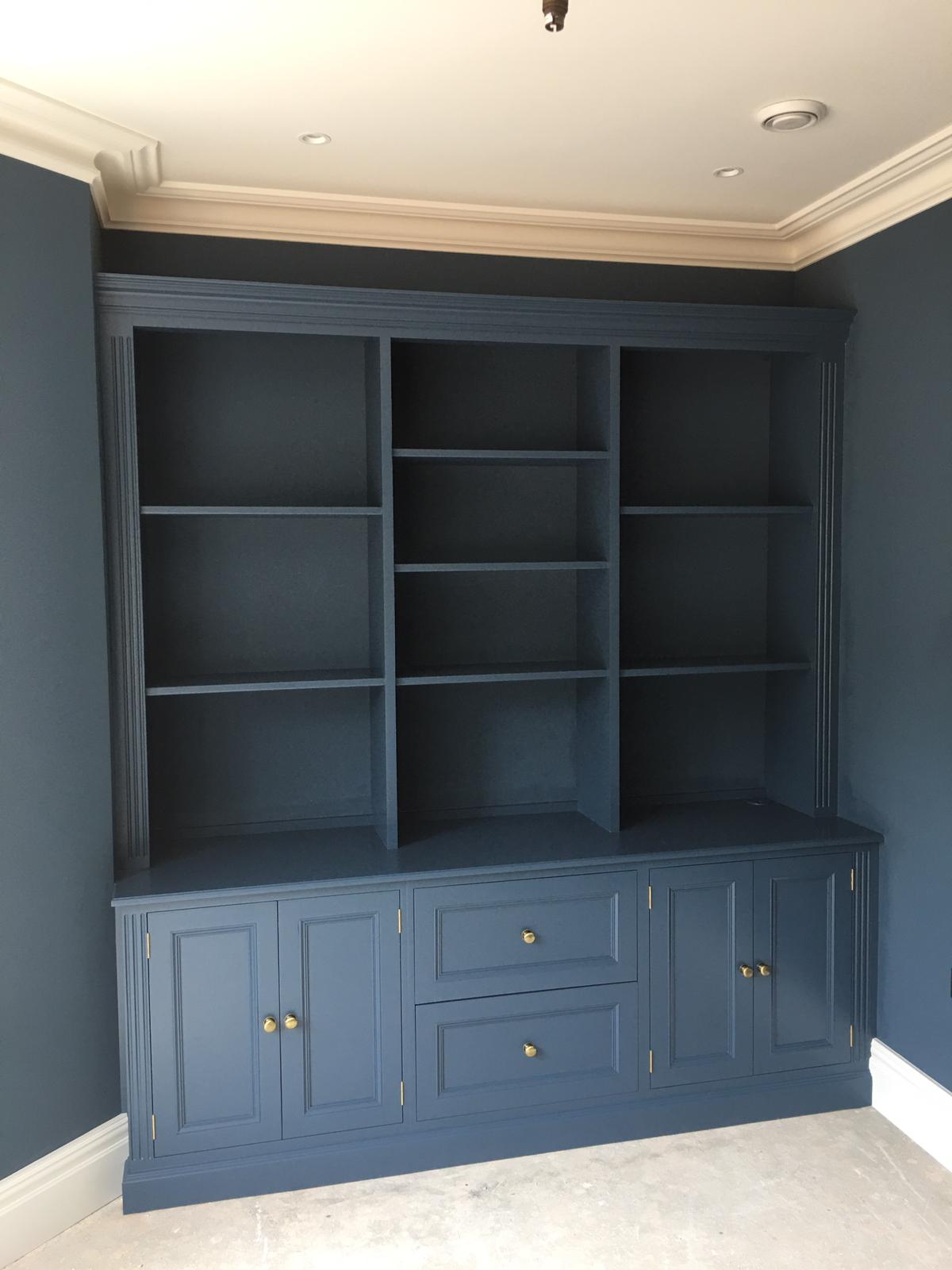 Dark painted fitted dresser with open shelves, cupboards and drawers