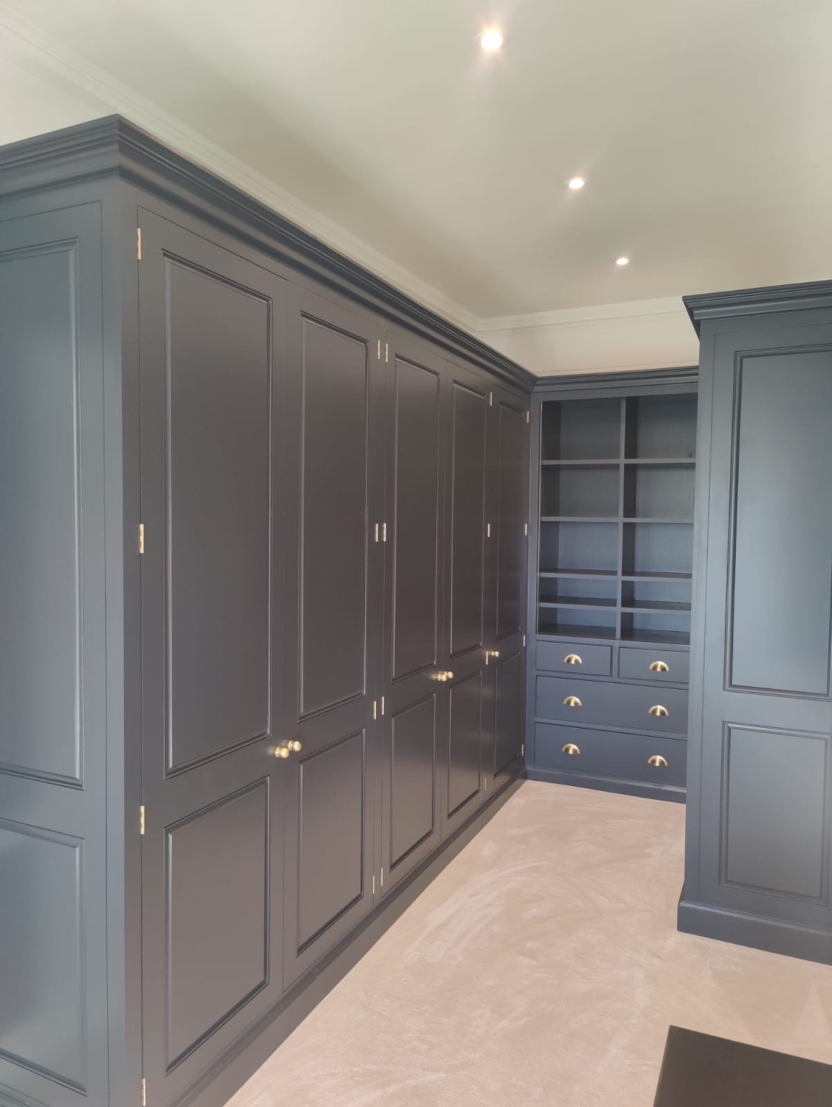 Dark painted fitted wardrobes and drawers
